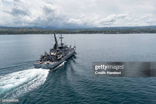 In this handout provided by the Australian Department of Defence, Armadale Class Patrol Boat, HMAS Armidale, sails into the Port of Honiara on...