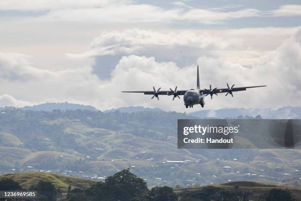 In this handout provided by the Australian Department of Defence, A Royal Australian Air Force C-130 Hercules aircraft, prepares to land at Honiara...