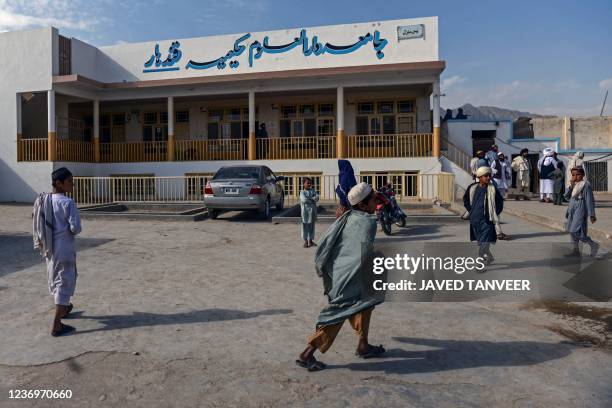 This picture taken on November 7, 2021 shows students at the Darul Uloom Hakimia madrassa where the Taliban Supreme Leader Hibatullah Akhundzada...
