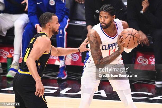 Los Angeles Clippers Forward Paul George guarded by Golden State Warriors Guard Stephen Curry during a NBA game between the Golden State Warriors and...