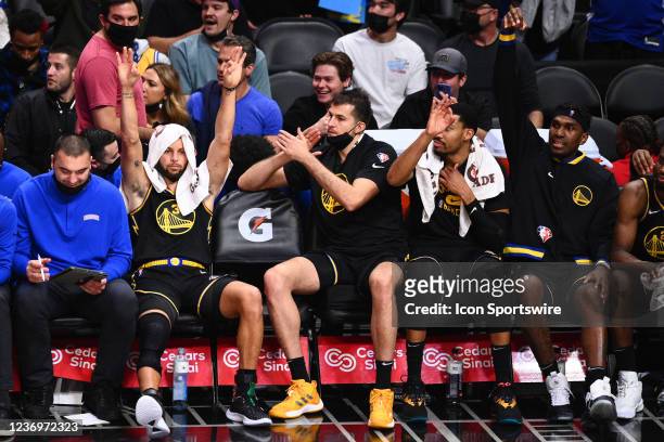 Golden State Warriors Guard Stephen Curry celebrates on the bench during a NBA game between the Golden State Warriors and the Los Angeles Clippers on...
