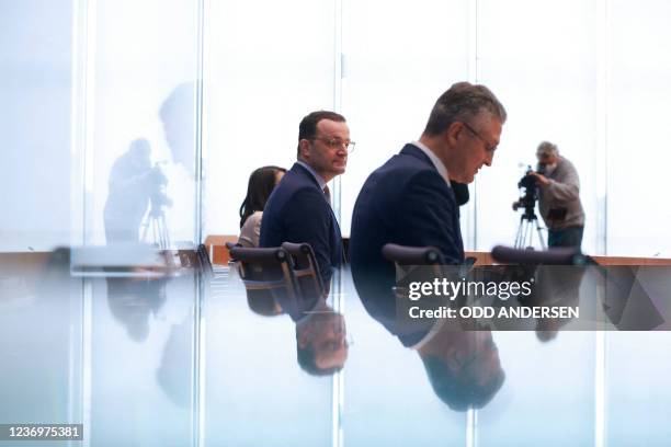 Lothar Wieler , president of the Robert-Koch-Institute , and German Health Minister Jens Spahn give a press conference on December 3, 2021 in Berlin,...