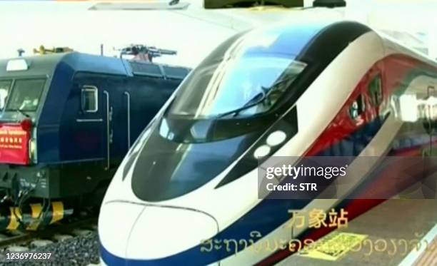 This frame grab from Lao National TV video footage taken on December 3, 2021 via AFPTV shows a train connecting the Laos capital Vientiane and the...