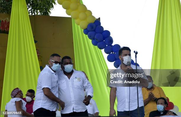 Former paramilitary member alias Juancho Dique hugs a relative of one of the victims of his extreme right group in Santa Lucia town, north of...