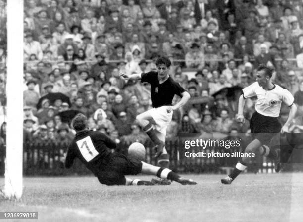 July 1954, Switzerland, Bern: German goalkeeper Toni Turek rushes towards Hungarian striker Sandor Kocsis , with halfback Horst Eckel on the right....