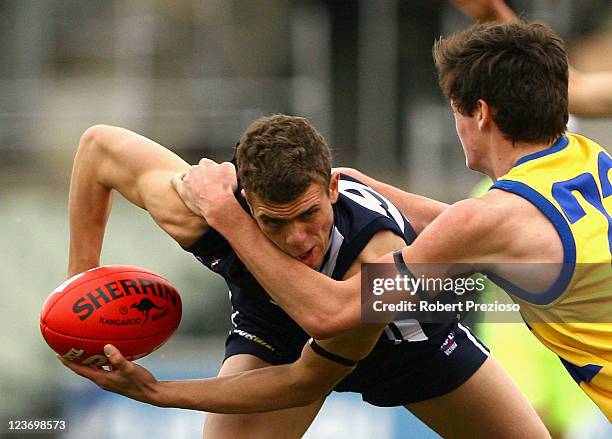 George Curnow of the Falcons is tackled during the Elimination Final match between the Western Jets and the Geelong Falcons at Visy Park on September...