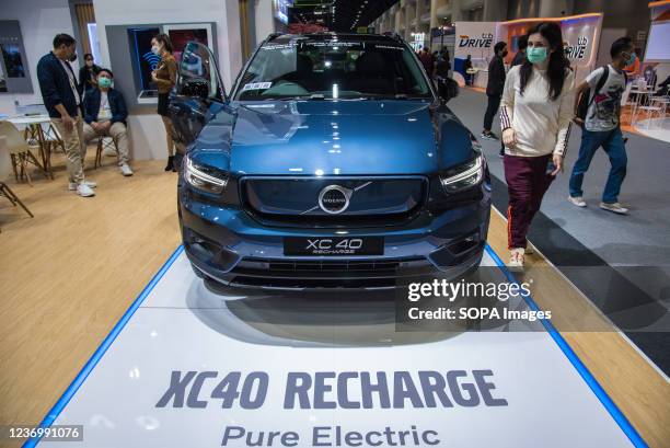 Visitor seen walking near a "Volvo XC40 Recharge" car displayed during the Motor Expo. The 38th Thailand International Motor Expo 2021 held from...