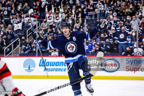 Mark Scheifele of the Winnipeg Jets celebrates his hat trick goal against the New Jersey Devils during third period action at the Canada Life Centre...