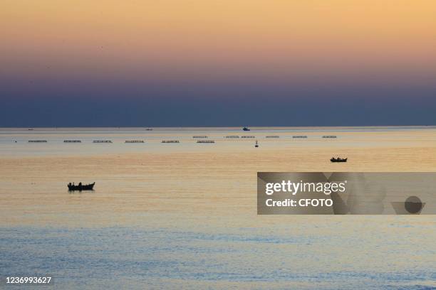 Sunrise rises over the Yellow Sea in Qingdao, Shandong Province, China, on the morning of December 4, 2021.