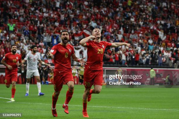 Of Syria team after scoring their team's first goal during the FIFA Arab Cup Qatar 2021 Group B match between Syria and Tunisia at Al Bayt Stadium on...