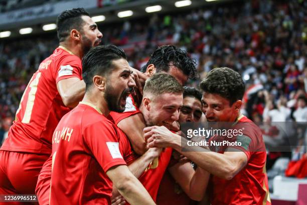 Of Syria team Celebrate with teammate after scoring their team's first goal during the FIFA Arab Cup Qatar 2021 Group B match between Syria and...