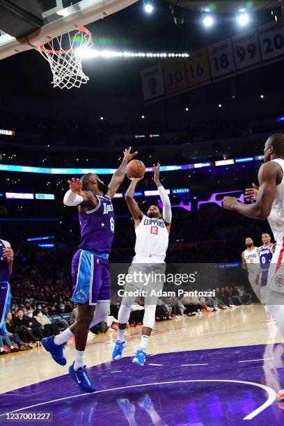 Paul George of the LA Clippers shoots the ball against LeBron James Los Angeles Lakers on December 3, 2021 at STAPLES Center in Los Angeles,...