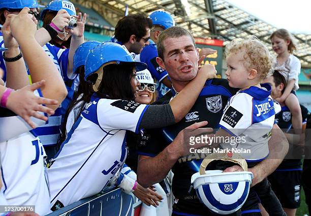 Andrew Ryan of the Bulldogs farewells supporters after the round 26 NRL match between the Canterbury-Bankstown Bulldogs and the Canberra Raiders at...