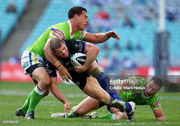 Andrew Ryan of the Bulldogs is tackled during the round 26 NRL match between the Canterbury-Bankstown Bulldogs and the Canberra Raiders at ANZ...