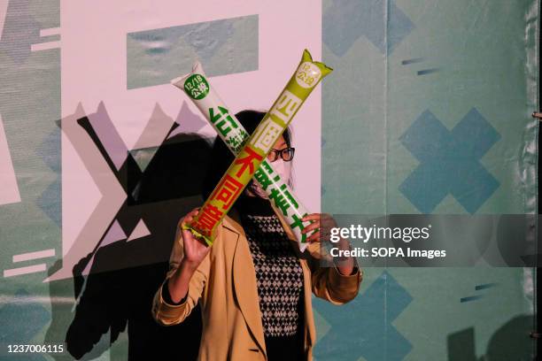 Supporter posing for a picture ahead of the Democratic Progressive Party event to promote the upcoming referendum that will be held on December 18...