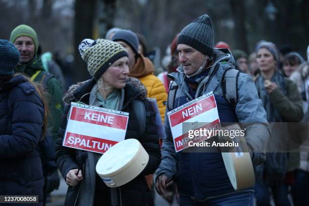 People gather to protest against vaccination requirement and coronavirus measures despite the curfew imposed throughout the country in Vienna,...