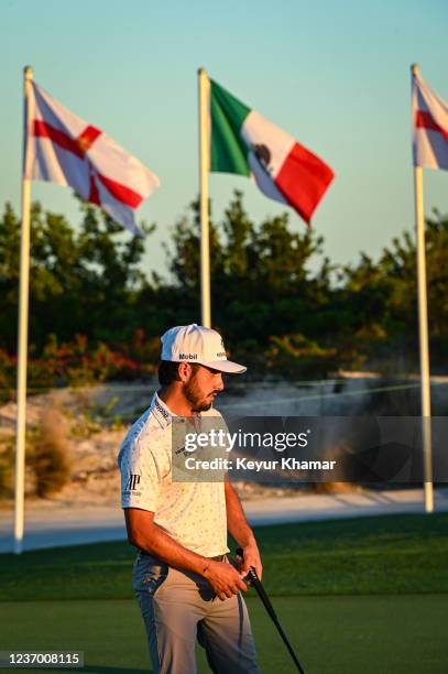 Abraham Ancer of Mexico putts on the practice green near the Mexican flag following the second round of the Hero World Challenge at Albany on...