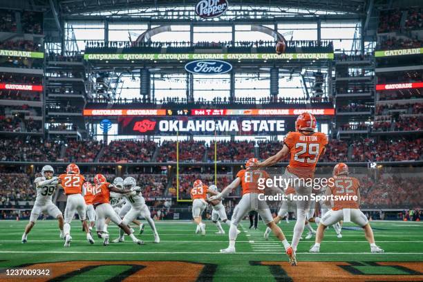Oklahoma State Cowboys punter Tom Hutton punts from the end zone against the Baylor Bears on December 4th, 2021 at ATT Stadium in Dallas Texas.