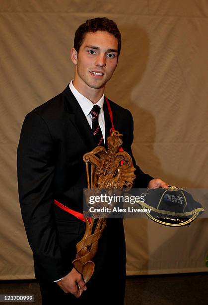 Wing George North the youngest member of the Wales squad poses with his Rugby World Cup cap and traditional welsh lovespoon during the official IRB...