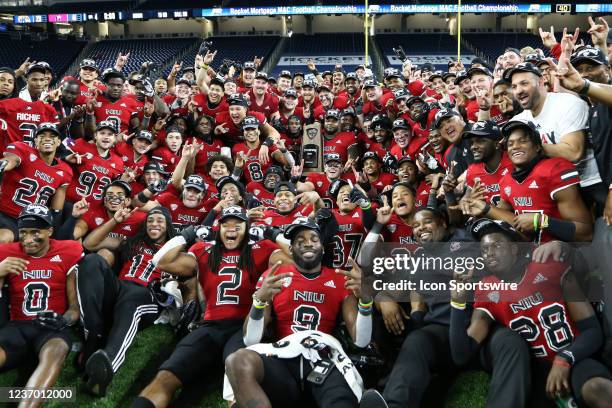 The Northern Illinois team poses for photographs during the awards ceremony for the Mid-American Conference football championship game between the...