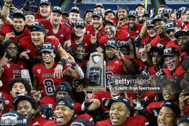 The Northern Illinois team poses for photographs during the awards ceremony for the Mid-American Conference football championship game between the...