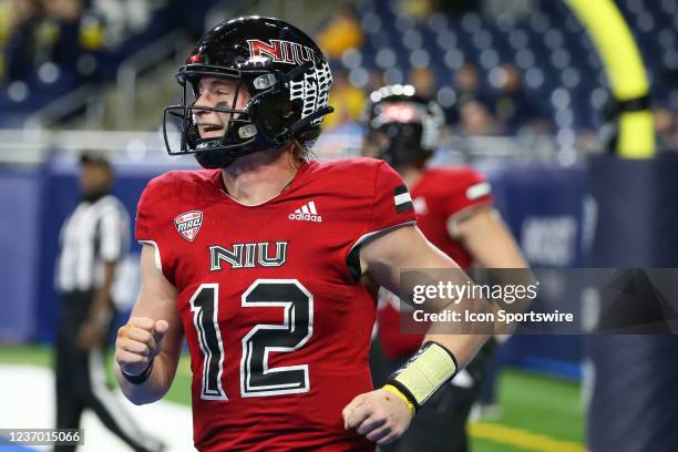 Northern Illinois Huskies quarterback Rocky Lombardi smiles as he runs to the sideline after scoring a touchdown during the Mid-American Conference...