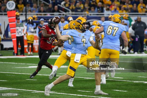 Kent State Golden Flashes quarterback Dustin Crum throws a pass during the Mid-American Conference football championship game between the Kent State...