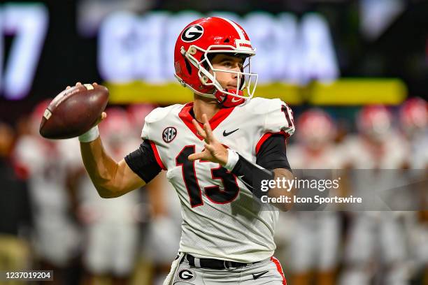 Georgia quarterback Stetson Bennett passes the ball during the SEC Championship college football game between the Alabama Crimson Tide and Georgia...