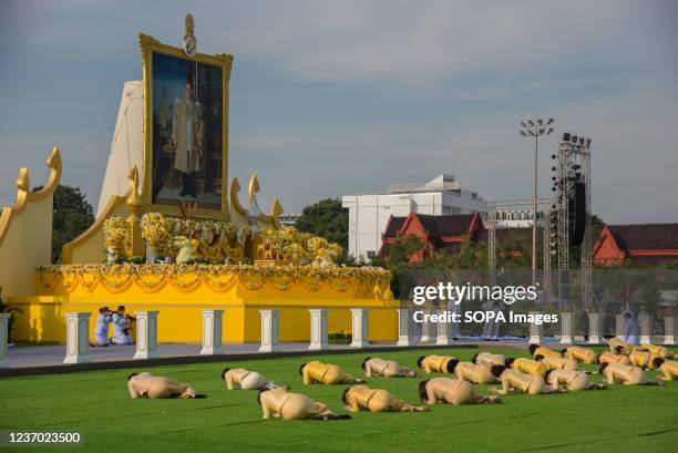 Thai government officials seen paying respect in front of a large portrait of the late Thai King Bhumibol Adulyadej during the ceremony in...