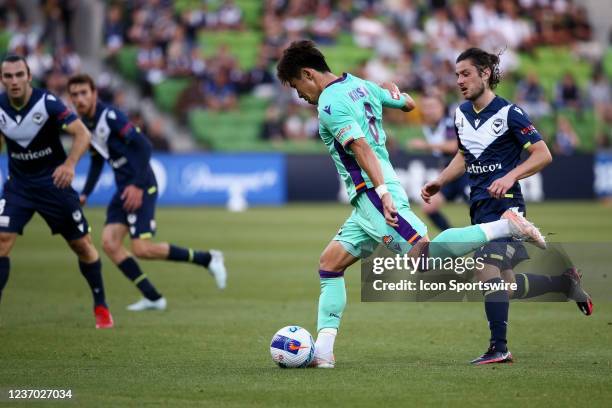 Kosuke Ota of Perth Glory kicks the ball during the round 3 A-League soccer match between Melbourne Victory and Perth Glory at AAMI Park on December...