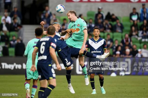Aaron Calver of Perth Glory heads the ball during the round 3 A-League soccer match between Melbourne Victory and Perth Glory at AAMI Park on...