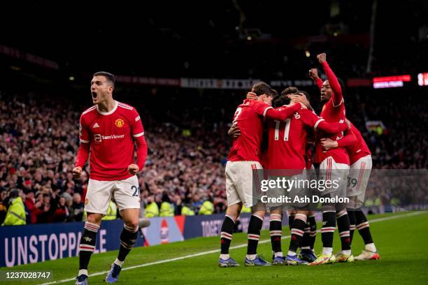 Fred of Manchester United celebrates scoring a goal to make the score 1-0 with team-mates during the Premier League match between Manchester United...