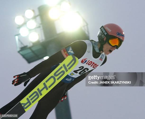 Jan Hoerl of Austria soars through the air during the FIS Ski Jumping World Cup in Wisla, Poland on December 5, 2021.
