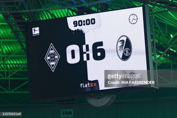 The final result is seen on the scoreboard after the German first division Bundesliga football match Borussia Moenchengladbach v SC Freiburg in...
