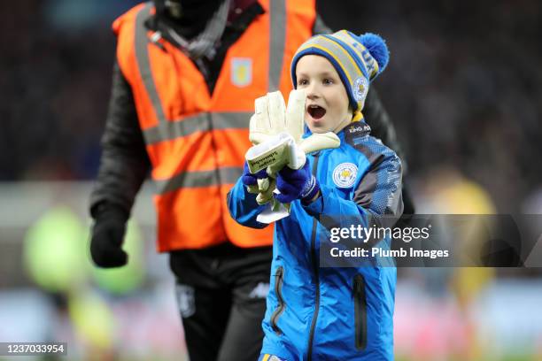 Young Leicester City fan with Kasper Schmeichel of Leicester Citys gloves after the Premier League match between Aston Villa and Leicester City at...