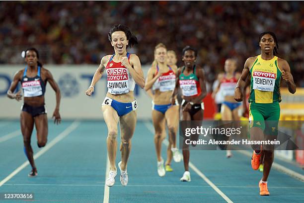 Mariya Savinova of Russia crosses the finish line ahead of Caster Semenya of South Africa to claim victory in the women's 800 metres final during day...