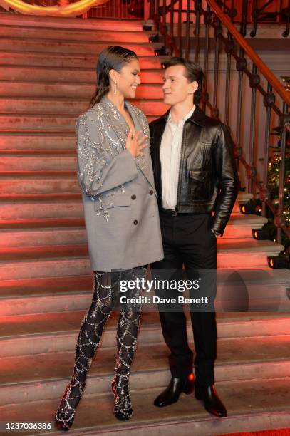 Zendaya and Tom Holland pose at a photocall for "Spider-Man: No Way Home" at The Old Sessions House on December 5, 2021 in London, England.