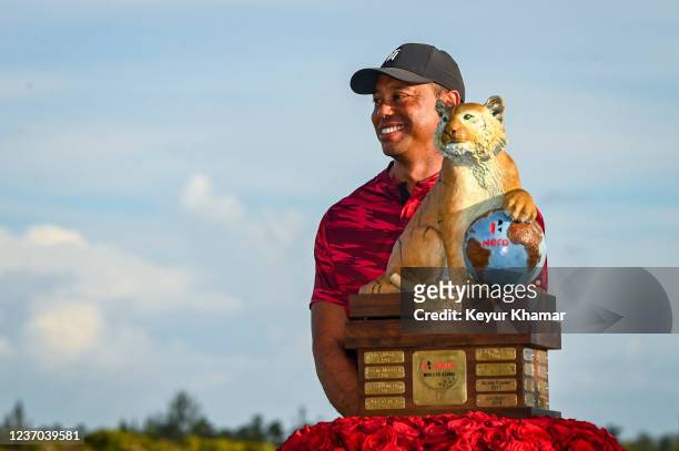 Tournament host Tiger Woods smiles during the trophy ceremony for Viktor Hovland following the final round of the Hero World Challenge at Albany on...
