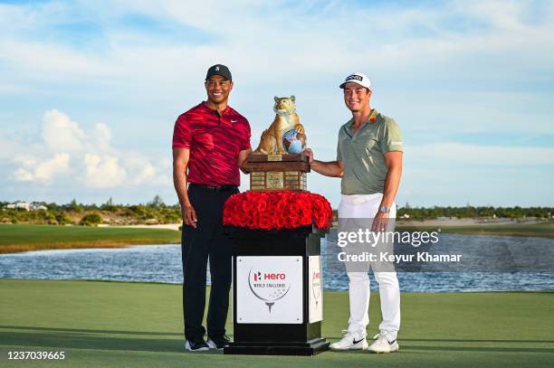 Tournament host Tiger Woods and Viktor Hovland of Norway smile during the trophy ceremony following Hovlands victory in the final round of the Hero...