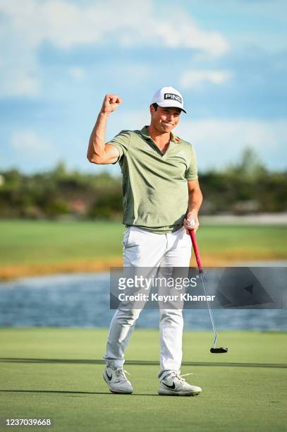 Viktor Hovland of Norway celebrates with a fist pump after his one stroke victory on the 18th hole green during the final round of the Hero World...