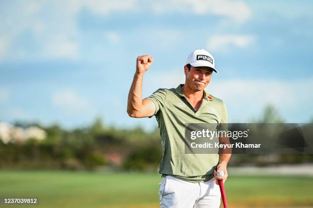 Viktor Hovland of Norway celebrates with a fist pump after his one stroke victory on the 18th hole green during the final round of the Hero World...