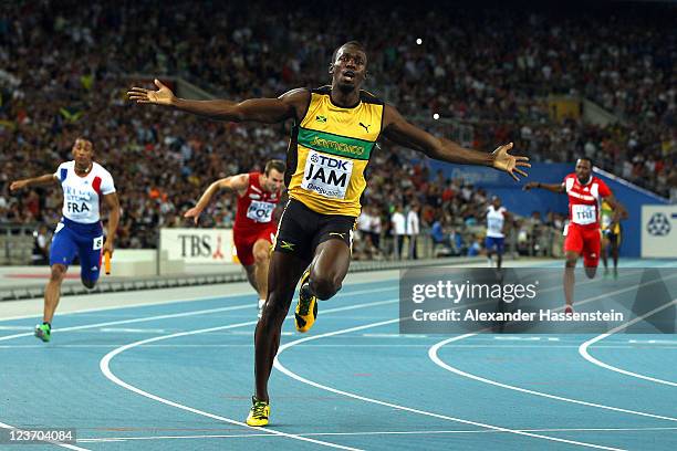 Usain Bolt of Jamaica celebrates victory and a new world record in the men's 4x100 metres relay final during day nine of 13th IAAF World Athletics...