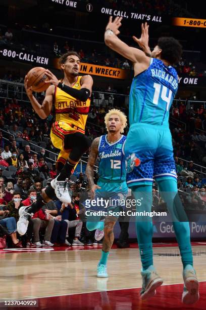 Trae Young of the Atlanta Hawks shoots the ball during the game against the Charlotte Hornets on December 5, 2021 at State Farm Arena in Atlanta,...