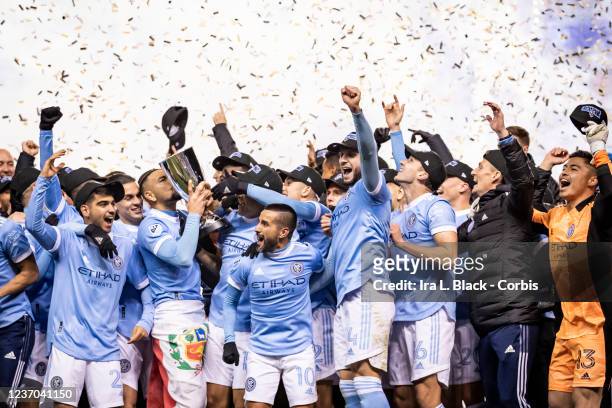Alexander Callens of New York City FC kisses the trophy and celebrates with teammates after winning the 2021 Audi MLS Cup Eastern Conference Final...
