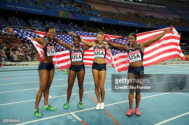 Marshevet Myers, Bianca Knight, Allyson Felix and Carmelita Jeter of the USA celebrate victory in the women's 4x100 metres relay final during day...
