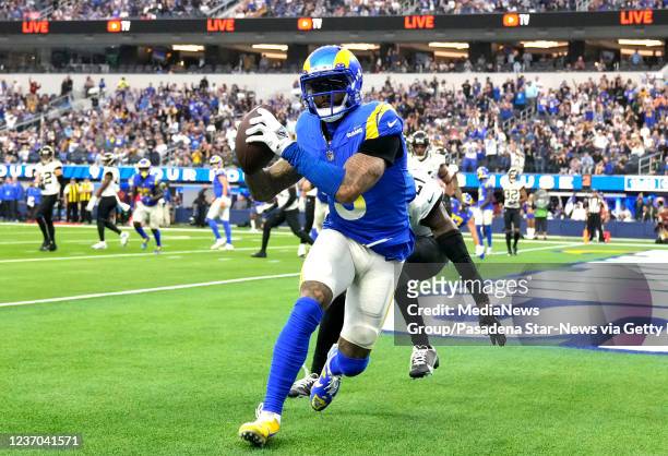 Inglewood, CA Wide receiver Odell Beckham Jr. #3 of the Los Angeles Rams catches a pass in the end zone over cornerback Nevin Lawson of the...