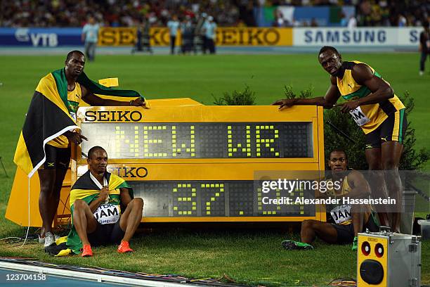 Nesta Carter, Michael Frater, Yohan Blake and Usain Bolt of Jamaica celebrate victory and a new world record in the men's 4x100 metres relay final...