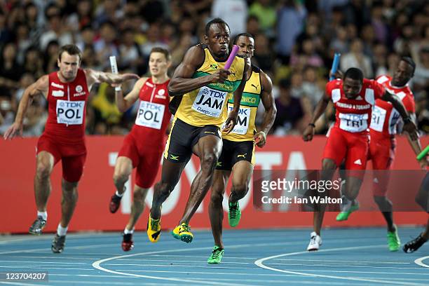Usain Bolt of Jamaica sprints to victory and a new world record in the men's 4x100 metres relay final during day nine of 13th IAAF World Athletics...