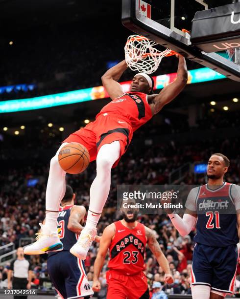 Precious Achiuwa of the Toronto Raptors goes up for a slam dunk against the Washington Wizards during the second half of their basketball game at the...