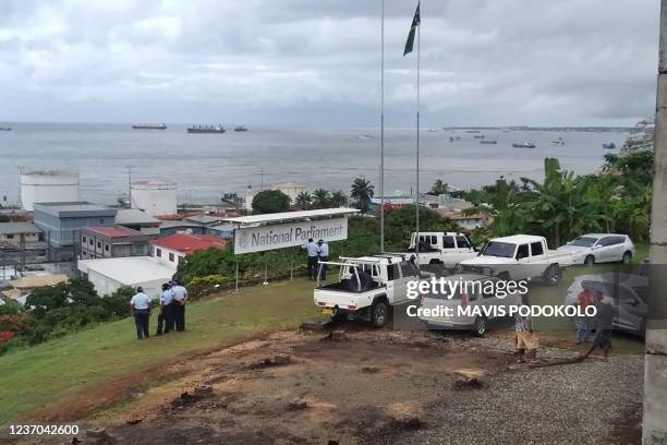 Police stand guard outside parliament on December 6, 2021 as Solomon Islands embattled Prime Minister Manasseh Sogavare faces a no-confidence vote,...